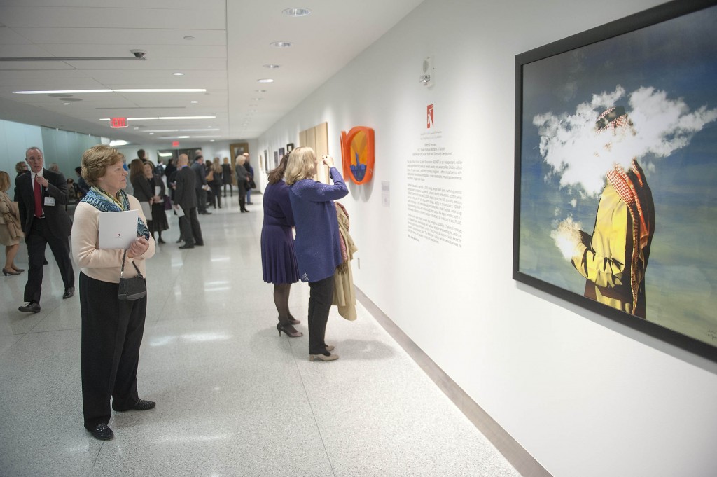 The paintings line the wall of this long corridor at the Exhibition in the US' Cleveland Clinic's Art Exhibit area.